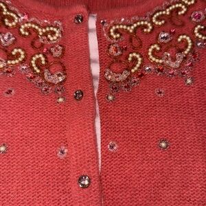 FREE PEOPLE Brand size S peach sweater never worn. Very unique detail.